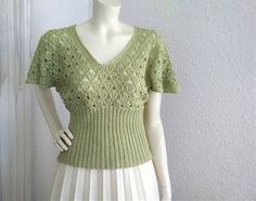 70s-80s knitted blouse, butterfly sleeve, see through, boho blouse, mesh top, V-neck summer lace blouse, very high waist, chartreuse green blouse, retro lurex shiny top, discreet shiny lurex fabric, dolman sleeve. no label size, no label composition, probably soft acryl fabric. very good vintage condition, the blouse is not washed. measurements laying flat : shoulders and both sleeves together :82 cm (32,5 inches) bust: 48 cm (19 inches) total lenght:55 cm (21,5 inches) Vintage Stretch V-neck Top, Green V-neck Knit Top For Summer, Fitted V-neck Crochet Top With Pointelle Knit, Green Open Knit Top For Summer, Bohemian Pointelle Knit Crochet Top With V-neck, Fitted Pointelle Knit Blouse For Summer, Fitted Knit Lace Top For Spring, Elegant Fitted Crochet Top With V-neck, Stretch V-neck Lace Top For Summer