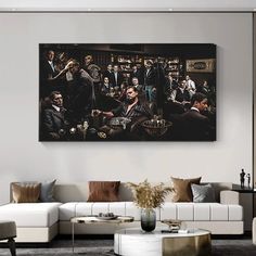 a living room filled with furniture and a large painting on the wall above it's coffee table