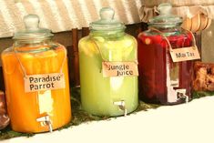 jars filled with liquid sitting on top of a shelf