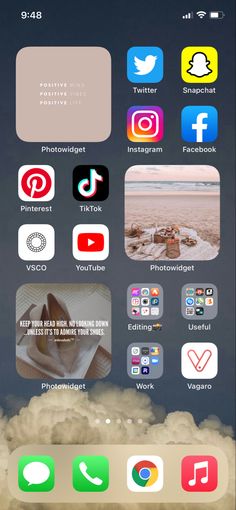 the home screen of an iphone with various icons on it and clouds in the background