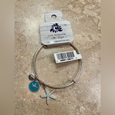 Silver Bracelet With Blue Starfish Charm New With Tags Silver Starfish Bracelet For Gift, Silver Starfish Bracelet, Adjustable Blue Starfish Jewelry, Metal Starfish Jewelry, Blue Metal Jewelry For Beach, Silver Charm Bracelet With Starfish For Beach, Silver Starfish Charm Bracelet For Beach, Silver Metal Charm Bracelet For Beach, Adjustable Blue Jewelry With Starfish Charm