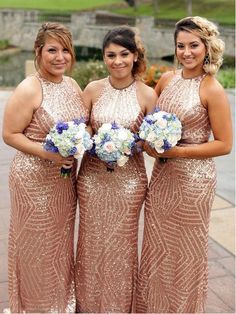 three bridesmaids in sequin dresses holding bouquets