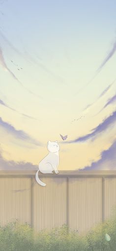 a white cat sitting on top of a wooden fence next to a bird flying in the sky