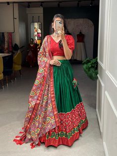 Printed lehenga choli for Navratri, green lehenga for garba function, trendy dola silk lehenga for festive,wedding chaniya choli for sangeet Lehenga(Stitched) Color : 1) Green2) Red  Lehenga Fabric : Dola Silk  Lehenga Work : Printed with foil work  Waist : SUPPORTED UP TO 40 Lehenga Closer : Drawstring With Heavy Tassels and Zip Stitching : Stitched With Canvas and attached with Can Can Length : 40 Flair : 4 Meter  Inner : Micro Cotton Blouse(UN stitched) Blouse fabric : Dola Silk   Blouse Work Chaniya Choli For Sangeet, Lehenga For Garba, Lehenga Choli For Navratri, Wedding Chaniya Choli, Sangeet Lehenga, Zip Stitching, Lehenga Stitched, Lehenga Fabric, Stitched Lehenga