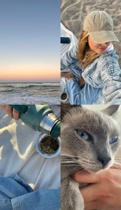 a woman holding a cat on top of a beach next to the ocean and sand