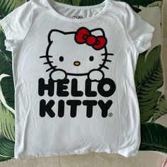 White Hello Kitty Shirt That Is Size 7-8 Never Worn Only Washed Hello Kitty T-shirts & Tank Tops, Playful White Hello Kitty T-shirt, White Casual Shirt With Cat Print, White Cotton Shirt With Cat Design, Retro Hello Kitty, White Hello Kitty, Hello Kitty Shirt, Diy Hello Kitty, Cat Shirts