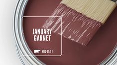 a paint can with a brush in it and the words january garnet on it