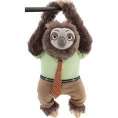 a stuffed animal with a tie hanging from it's neck and head on a pole