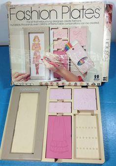 an open box with some pink and white items in it on a blue tablecloth