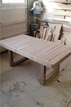 a table made out of wooden planks in a garage