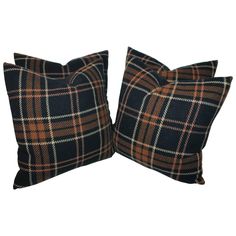 two brown and black plaid pillows on white background