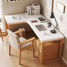 a desk with a chair, lamp and pictures on the wall in front of it