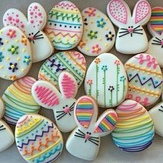 some decorated cookies are sitting on a table