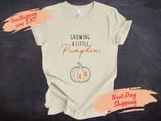 Growing A Little Pumpkin Shirt Fall Maternity Sweater Pregnancy Thanksgiving Sweatshirt Fall Pregnancy Announcement Gift Pregnancy Reveal Create your own T-shirt ↠ We have size chart on our listing photos. ↠ We use Bella Canvas, Gildan, LAT, Rabbit Skins, Hanes brands shirts for orders according to availability. If you want any exact of these brands please contact us. ↠ The shirts are Unisex, Women, Youth, Toddler and Baby size. Orange and Black colors ships next day the other colors may take fe Fall Pregnancy, Fall Pregnancy Announcement, Thanksgiving Sweatshirt, Pregnancy Announcement Gifts, Fall Maternity, Pregnancy Reveal, Pumpkin Shirt, Pregnancy Reveals, Maternity Sweater