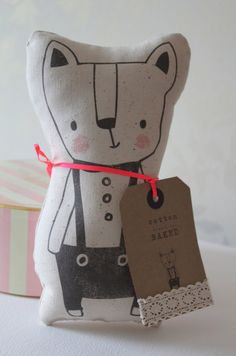 a stuffed animal with a tag attached to it