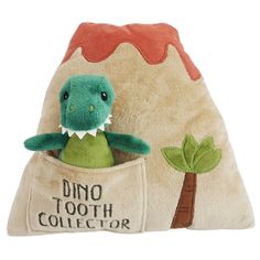 a stuffed dinosaur in a pocket with the words dino tooth collector on it