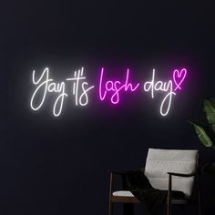 a neon sign that reads you're it's irish day on the wall next to a chair