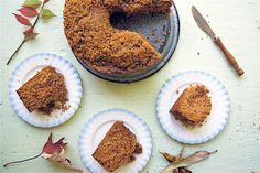 three pieces of cake sitting on plates next to a knife and two slices are missing