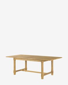 a wooden table on a white background with no one around it or the table is empty