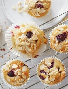 several muffins with cranberries and almonds in them