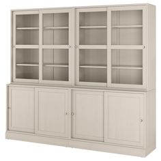 a white bookcase with glass doors and drawers