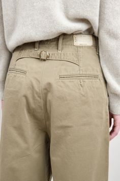 The Chino High Waist NIME Pants are a slightly oversized barrel leg pant with front pleats. Featuring the signature Kapital posterior waist buckle, these pants are a take on a classic trouser with a touch of modern style. Khaki Color Combination, Chinos Women Outfit, Bush Pants, Menswear Pants, Man Trousers, Sunday Market, Beige Chinos, Trousers Details, Womens Chinos