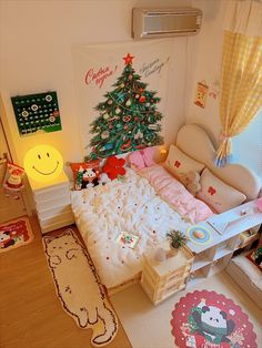 a bedroom with a christmas tree on the wall next to a small bed and chair