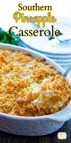 southern pineapple casserole in a white dish with a serving utensil