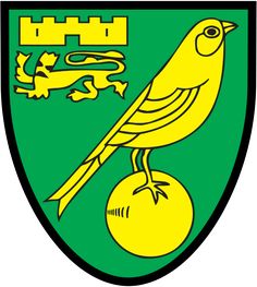 a bird sitting on top of a ball in front of a green and yellow shield