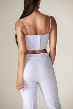 Our 'Carla' crop structure top is beautifully crafted from a crepe fabric in a off white tone to welcome in the warmer season. Inspired by traditional crop top, The boning provides corset-inspired structure and support that snatches the figure and we love the ruching across the bust to enhance the feminine feel in a 90's inspired straight neckline held by delicate spaghetti straps.We think the cropped length works well with a 'Niaz' high waisted wide legs pants.It has adjustable hooks and eyes t Traditional Crop Top, Baby Crop Top, White Tone, 90s Inspired, Straight Neckline, Modern Dress, Wide Legs, Crepe Fabric, Baby Blue