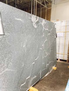 a large gray marble slab in a warehouse