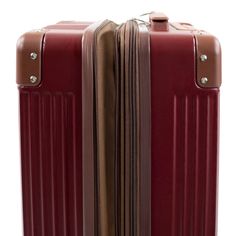 Immerse yourself in timeless elegance with the Tresor collection, a chic reinterpretation of vintage trunks that seamlessly blends sophistication with modern functionality. Both the rolling carry-on and the vanity case boast a scratch-resistant hard shell, ensuring durability and style for your travels. Adorned with corner protectors that harmonize with handles, wheels, and zippers, the Tresor collection exudes subtle charm. Unleash the expandable carry-on's spacious compartment, featuring a zip Elegant Brown Luggage For Overnight Trips, Classic Brown Travel Accessories With Luggage Sleeve, Classic Rectangular Cases For Overnight Trips, Elegant Brown Luggage For Travel, Elegant Brown Travel Accessories, Classic Rectangular Travel Luggage, Classic Cognac Luggage With Sleeve, Burgundy Handheld Travel Bag, Timeless Burgundy Travel Bag