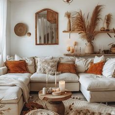 a living room filled with lots of furniture and decor on top of a wooden table