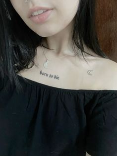 a woman wearing a black top with the words born to be written on her chest