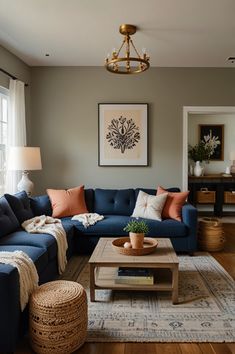 a living room filled with furniture and a rug on top of a hard wood floor