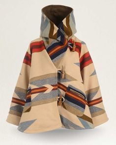 An exquisite statement piece, designed by Lindsey Thornburg and crafted from one of our wool jacquard blankets, woven in our Pendleton, Oregon mill. Each cloak is hand-cut, then sewn and finished in Lindsey’s Manhattan studio using premium trims. The bell-shaped silhouette features horn toggle closures, oversized raglan sleeves, a large cocoon hood, two welted patch pockets and a swingy fit for easy layering. Each cloak weighs 6 lbs. and is appropriate for mountain winters. This design features Lindsey Thornburg, Pendleton Blankets, Pendleton Blanket, Pendleton Woolen Mills, Blanket Coat, Sweat Dress, Hooded Cloak, Silk Wool, Cotton Wool