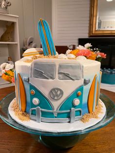 a blue and white cake sitting on top of a table