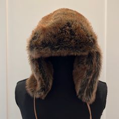 Excellent Condition. Never Worn. Color Is Reddish-Brown. Inside Brown Satin Lining. Size Small/Medium Adjustable Brown Hats With Faux Fur Lining, Faux Fur Beanie Hats For Fall, Fall Faux Fur Beanie Hat, Faux Fur Beanie For Fall, Brown Hat With Faux Fur Lining For Outdoor, Brown Hat With Faux Fur Lining And Ear Flaps, Brown Hats With Faux Fur Lining And Ear Flaps, Brown Faux Fur Outdoor Hats, Brown Faux Fur Hats For Outdoor