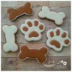 dog paw and bone cookies on a wooden table