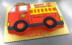 a birthday cake that is shaped like a fire truck