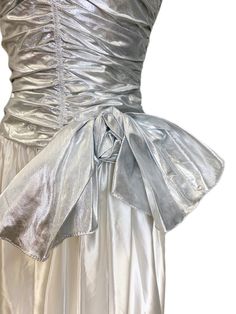 Vtg Nadine 70s Prom Queen Strapless Metallic Silver/White NWT S Maxi Elegant-This gown is spotless, brand new, with tags, and was featured in the magazine "Seventeen". It is comprised of acetate satin in snow white with metal silver ruched strapless boned bodice and bow. Has a back nylon zipper. Chest: 35" Waist: 26" Hips: Free Length from Armpit: 52" 70s Prom, Prom Queen, Miss Kitty, Boned Bodice, Prom Queens, Vintage Fits, Seventeen, Metallic Silver, Fitness Fashion