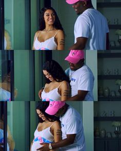 a man and woman wearing pink hats standing next to each other in front of a mirror