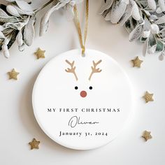 a personalized christmas ornament with reindeer's nose and antlers on it