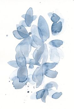 some blue watercolors on white paper