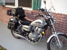 a motorcycle parked next to a brick building