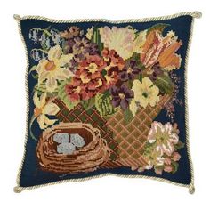 a blue pillow with flowers and a basket on it