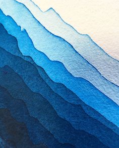 an abstract watercolor painting of blue mountains