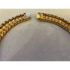 This is part of Chairish’s Costume Jewelry assortment.  A magnificent and weighty gold-tone and white enameled Ciner choker/collar, ca. late 1950s/early 1960s.  This choker belonged to a notable costume jewelry industry professional, who worked for Trifari.  Ciner jewelry was founded in New York City in 1892 as a fine jeweler and this family-owned operation is still in business today!  Since 1931, the company has produced fine costume jewelry. Luxury Yellow Gold Choker For Formal Events, Vintage Gold Round Choker, Luxury Gold Choker For Formal Occasions, Vintage Gold Bracelet With Polished Finish, Antique Gold Choker Jewelry, Luxury Gold Choker With 17 Jewels, Vintage Gold Chain Choker Jewelry, Vintage Gold Choker For Formal Occasions, Formal Yellow Gold-plated Choker