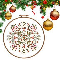 a cross stitch christmas ornament with ornaments hanging from it's sides and on the side