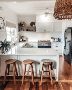 two stools are in front of the kitchen island